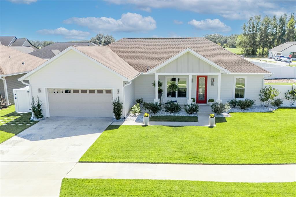 a view of house with swimming pool yard and outdoor seating