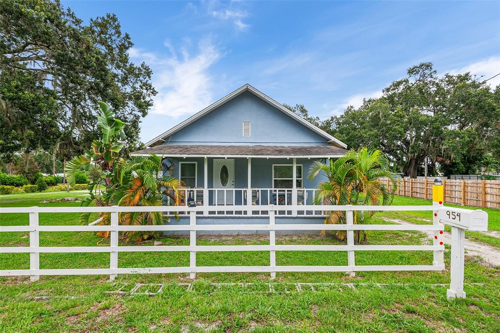 a view of a house with a yard and plants