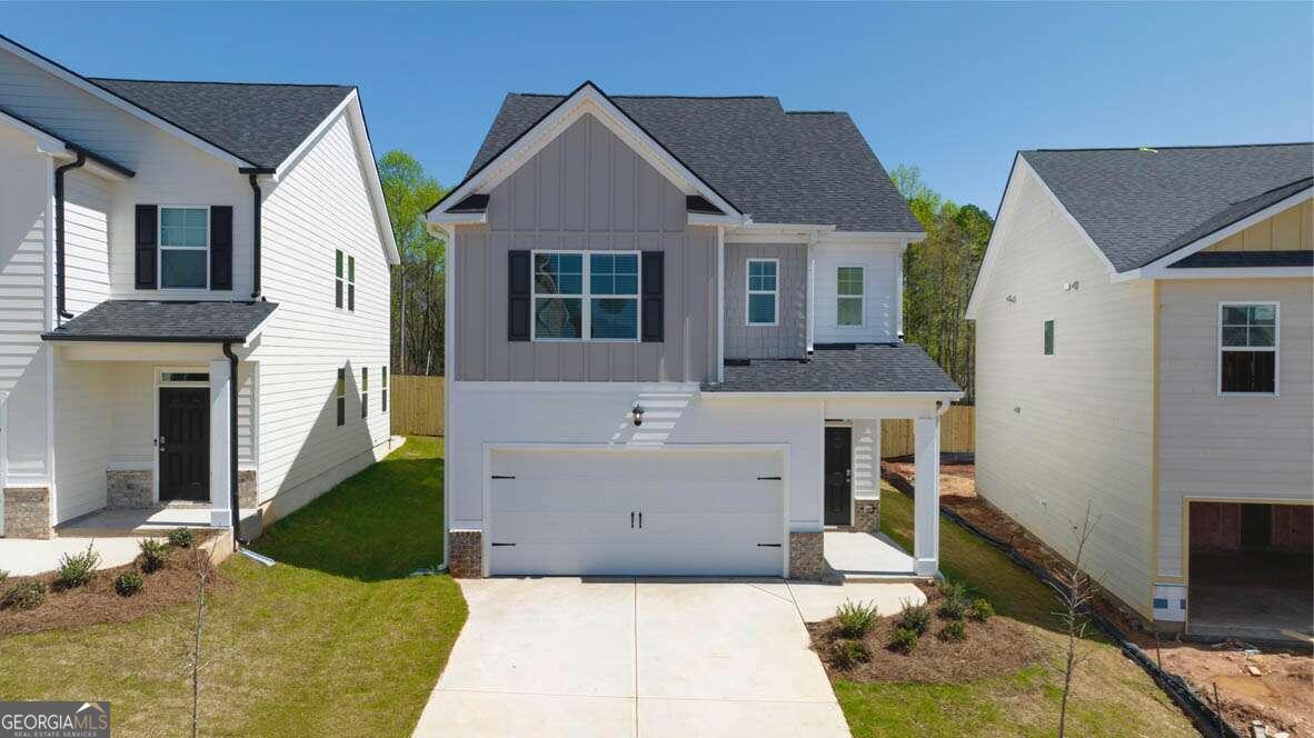 a front view of a house with a yard