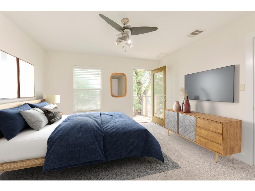 a bedroom with a bed window and couch