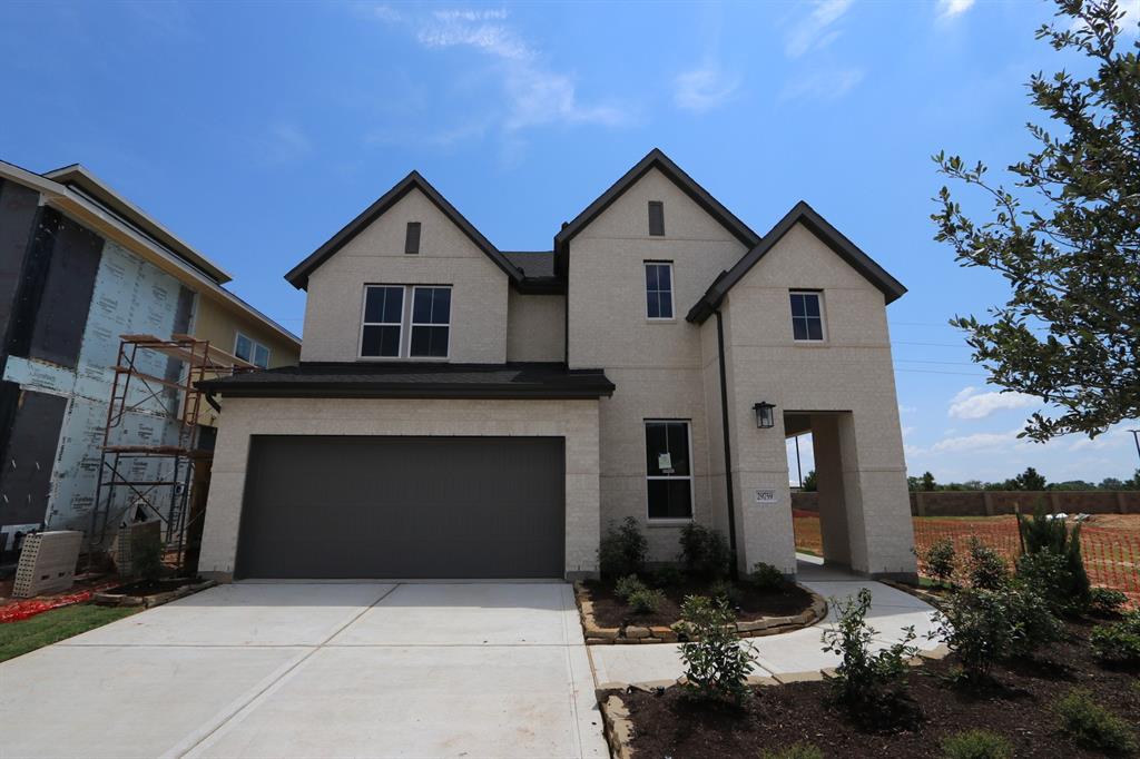 a front view of a house with garage