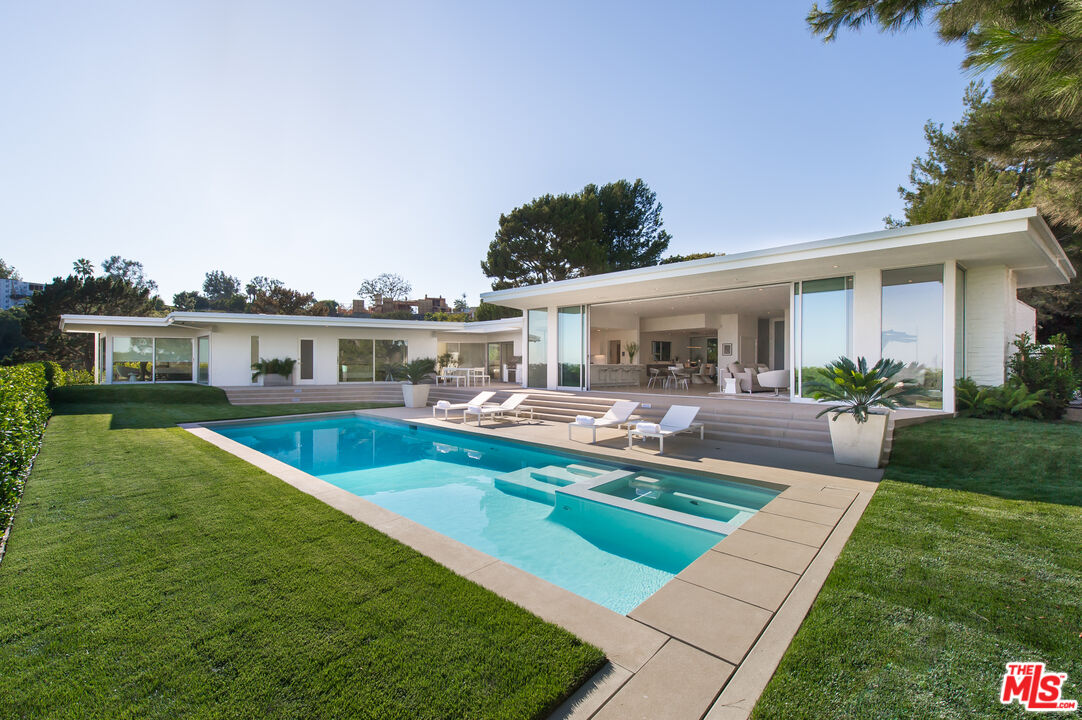 a view of a house with a swimming pool