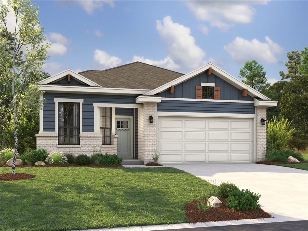 Craftsman house with a front yard and a garage