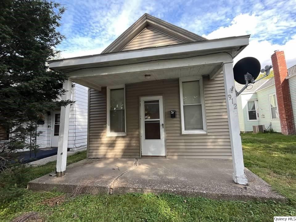 a front view of a house with garage