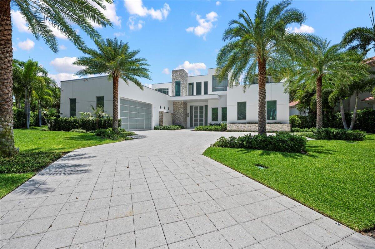 a front view of house and yard with green space