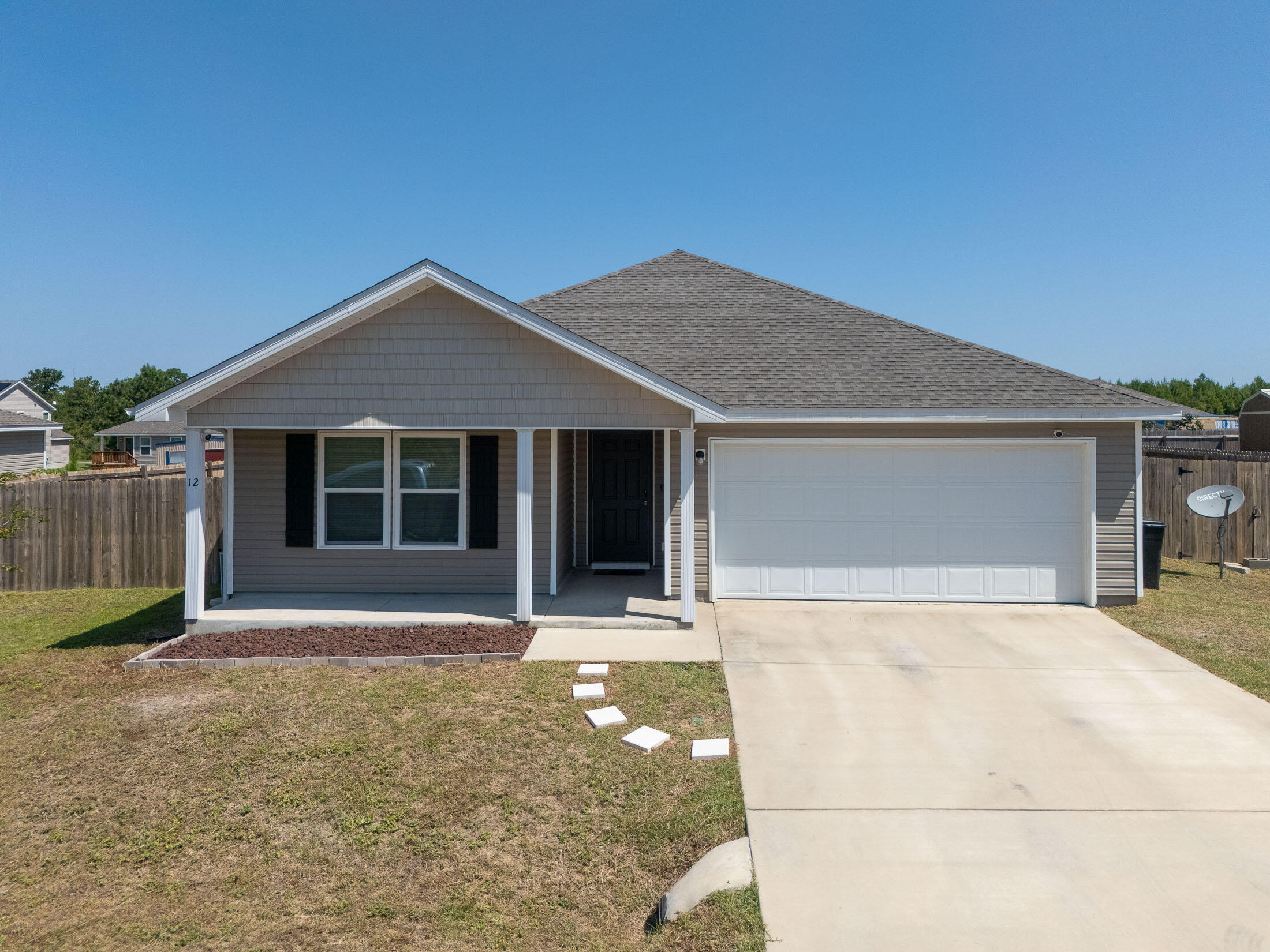 a house with yard in front of it