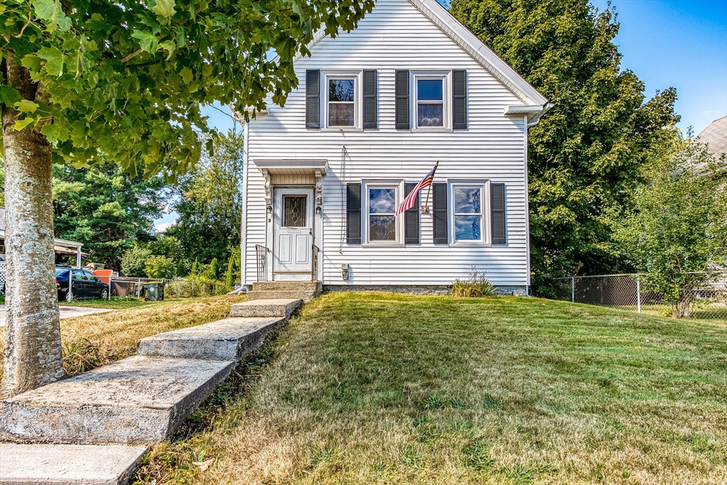 a front view of a house with a yard