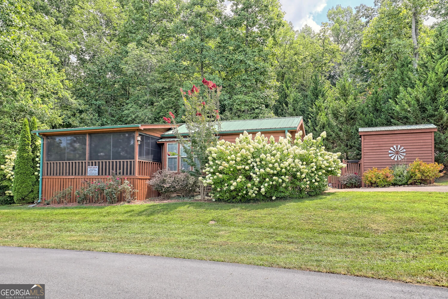 a view of a back yard of the house