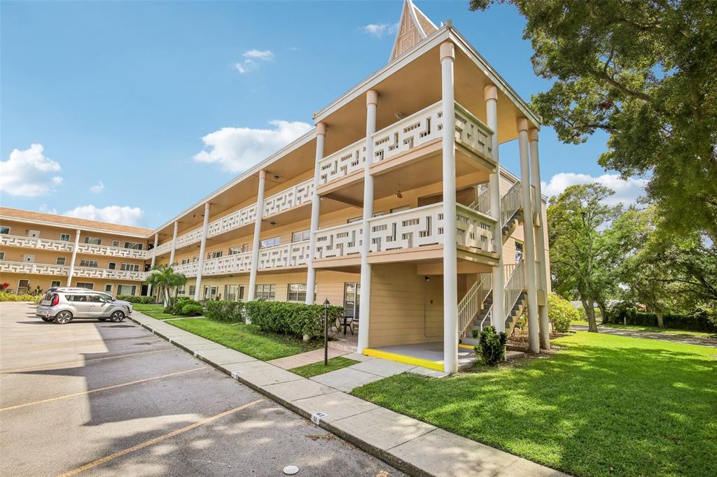 a view of a building with a yard