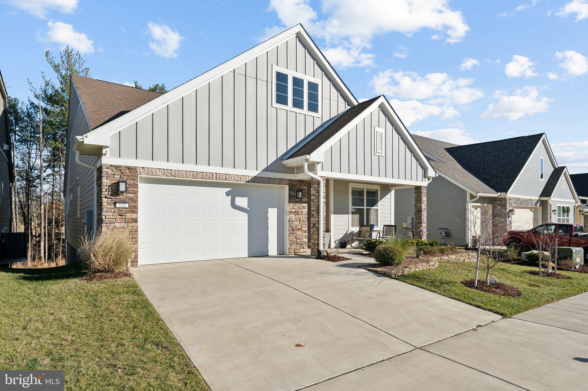 a front view of house with yard outdoor seating and barbeque oven