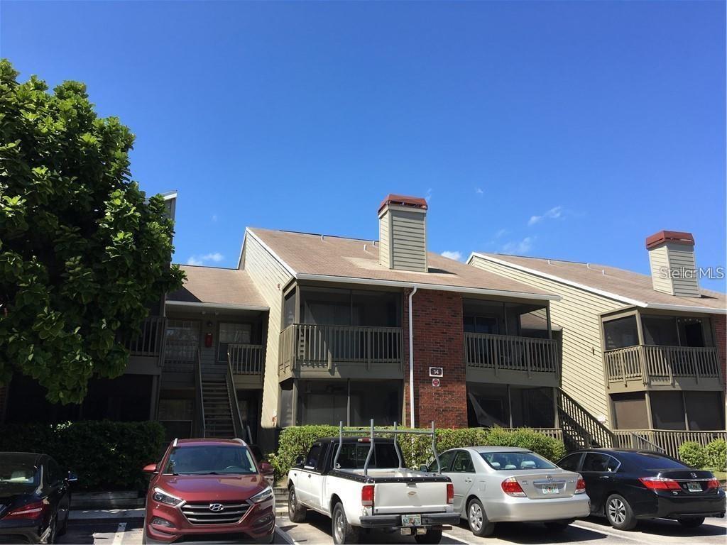 a front view of a house with parking space