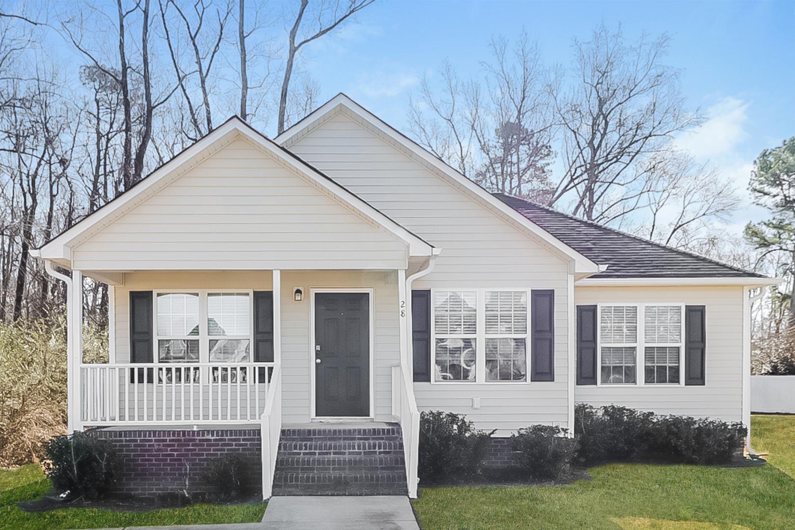 a front view of a house with a yard