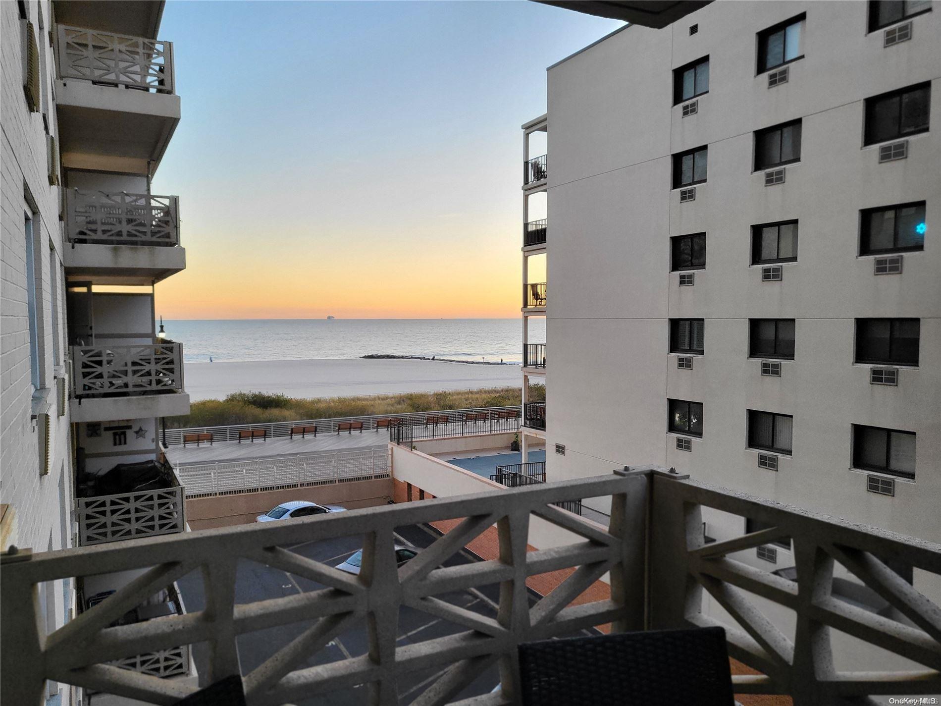 a view of a balcony with table and chairs