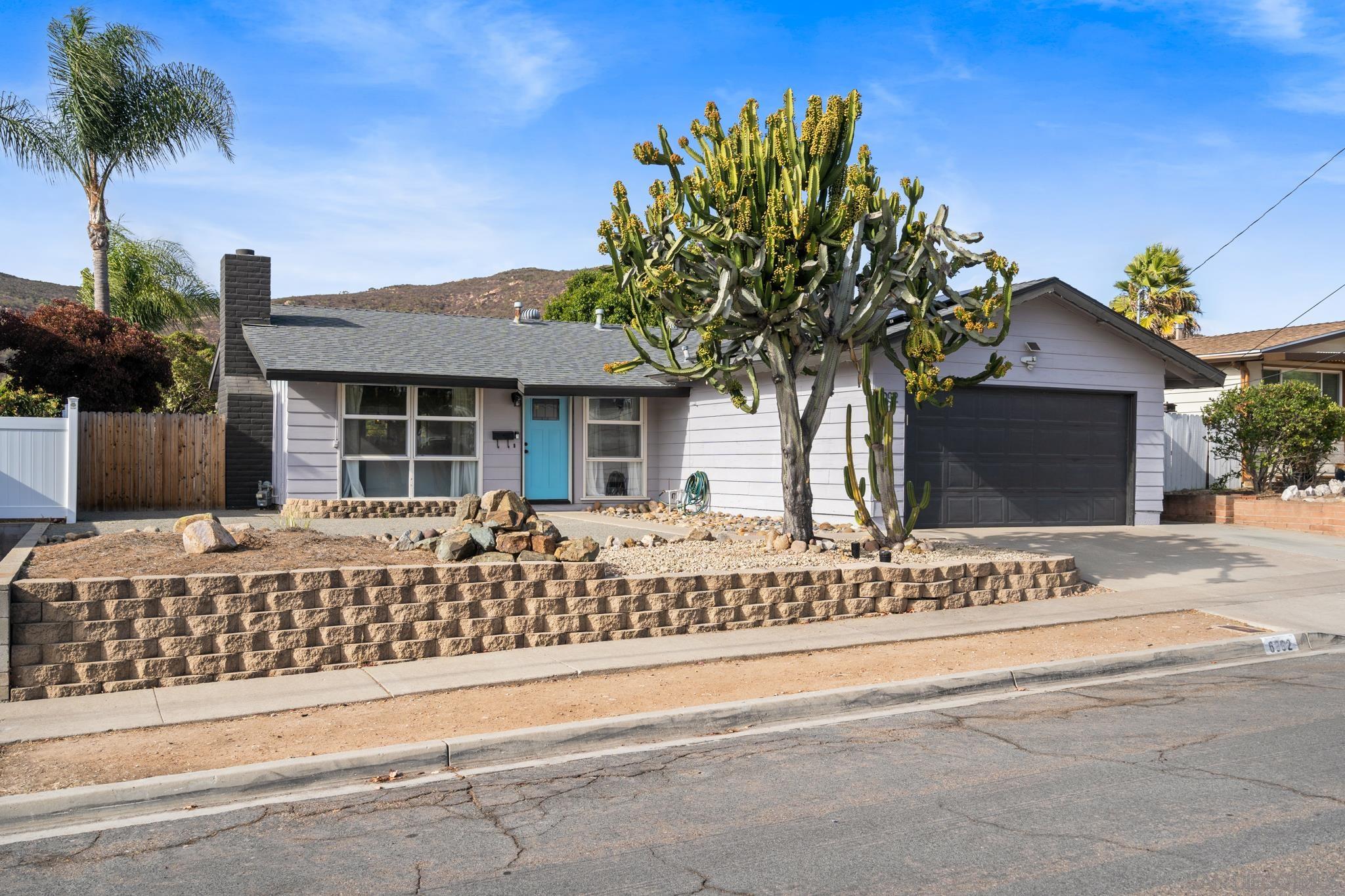 front view of a house with a garden