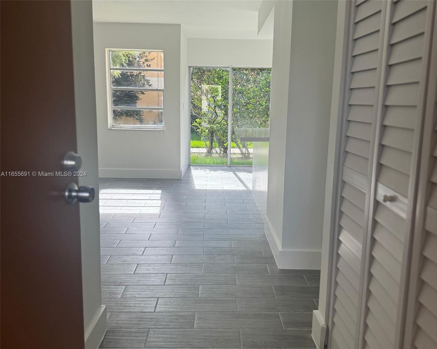 a view of hallway with a window