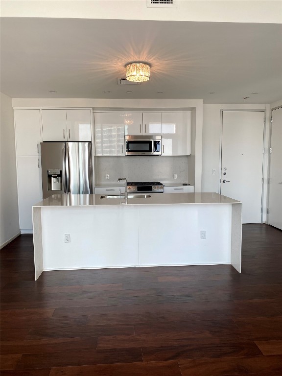 a view of kitchen with cabinets and wooden floor