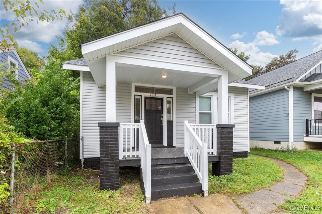 a front view of a house with a porch