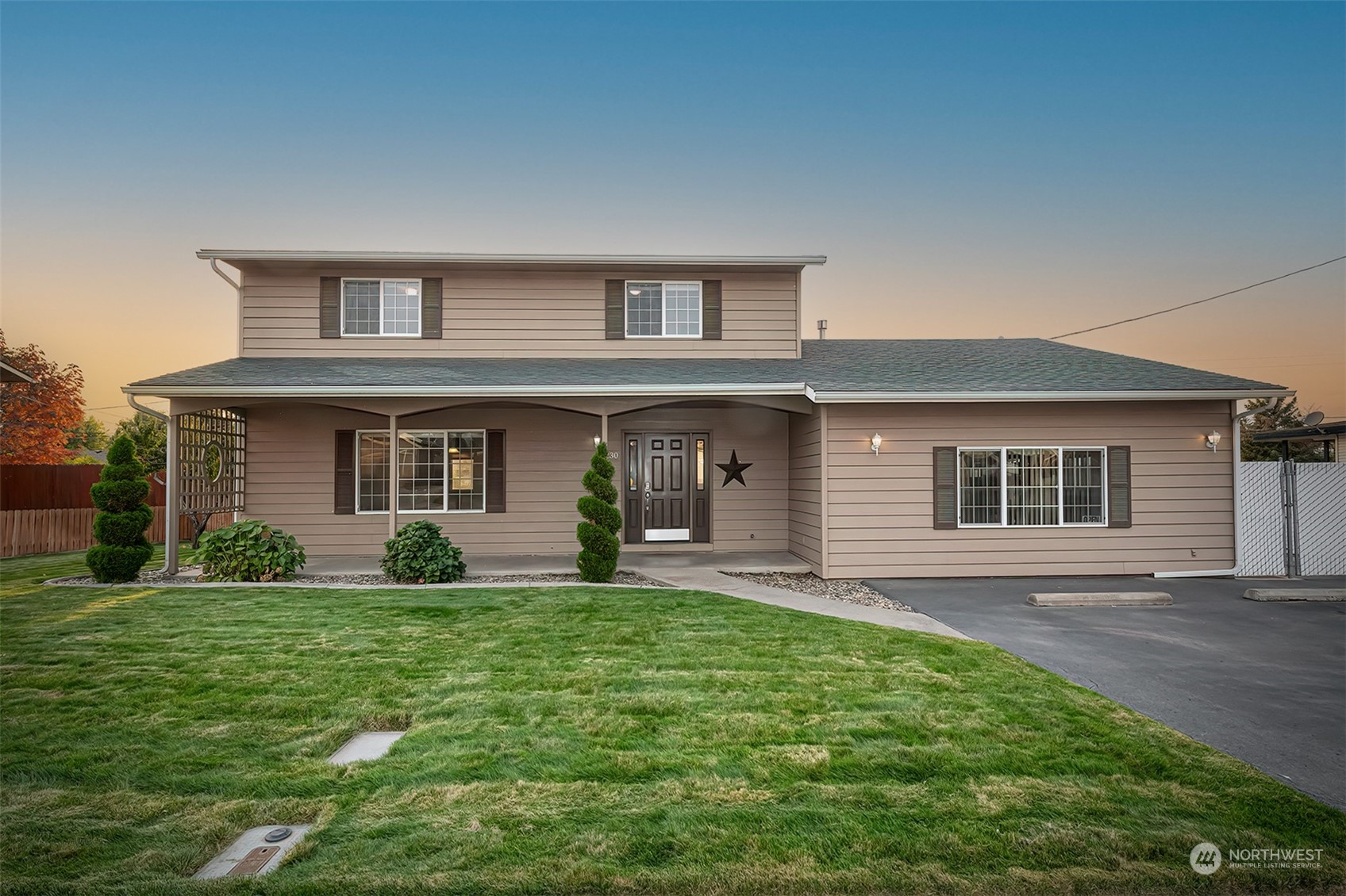 front view of a house with a yard