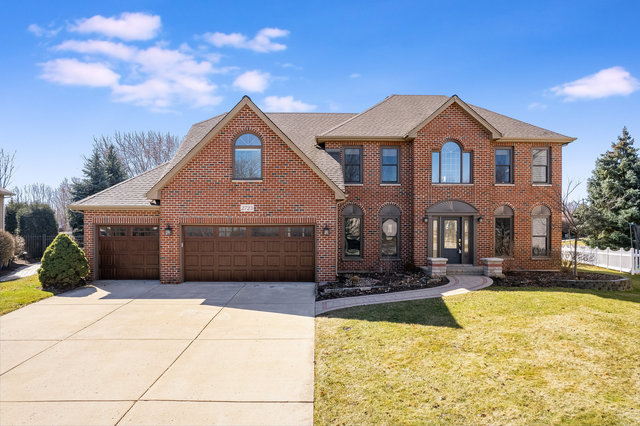 a front view of a house with yard