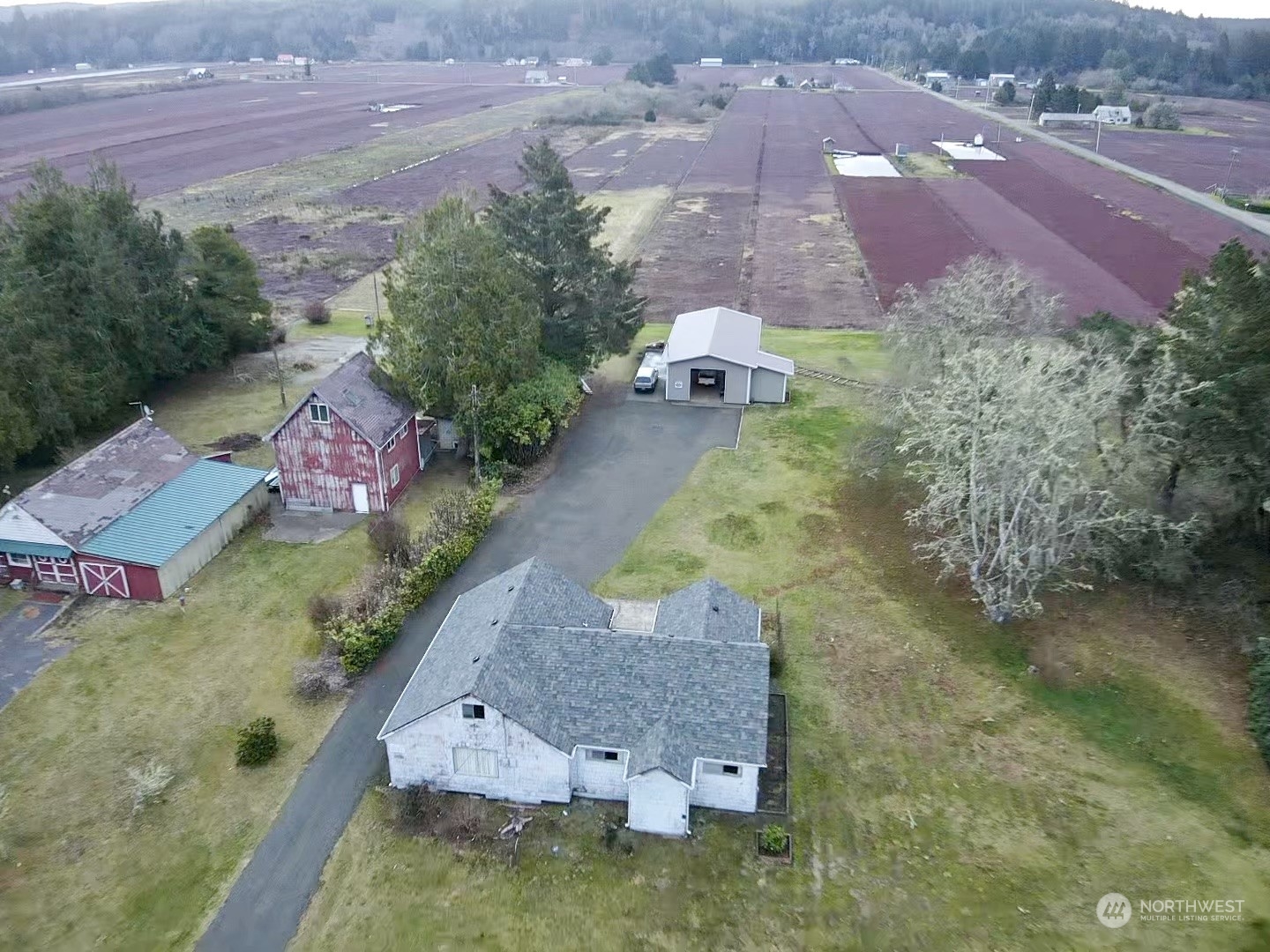 an aerial view of house with yard swimming pool and outdoor seating