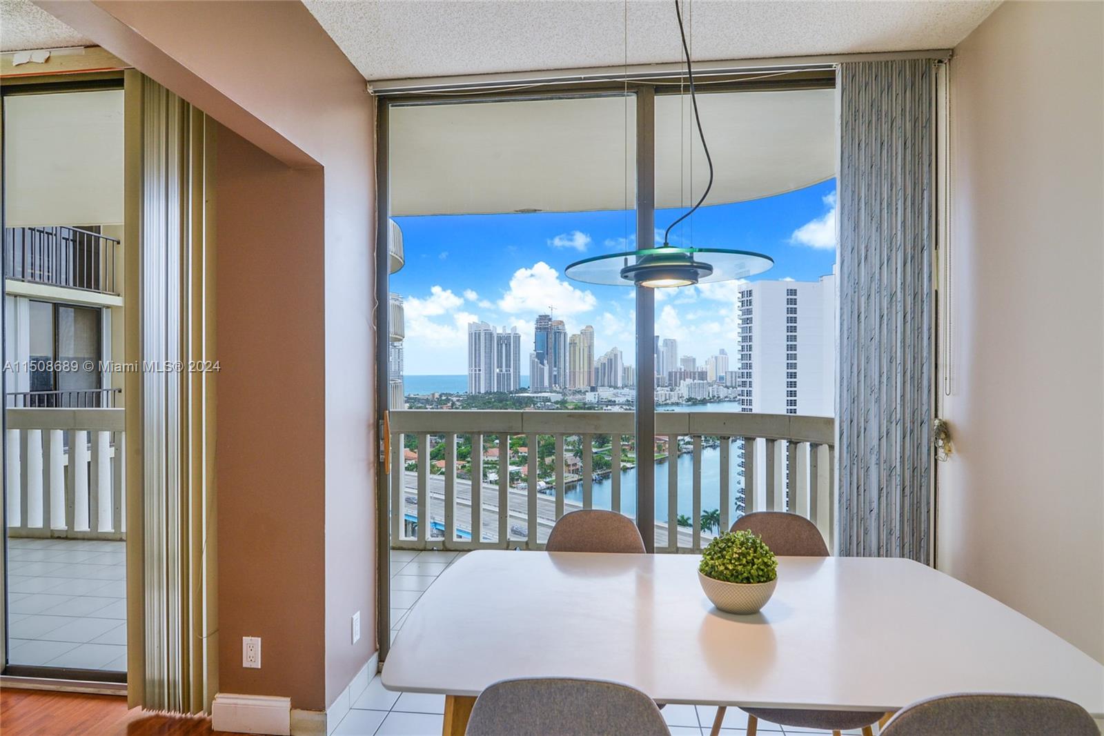 a view of a dining room with furniture window and outside view