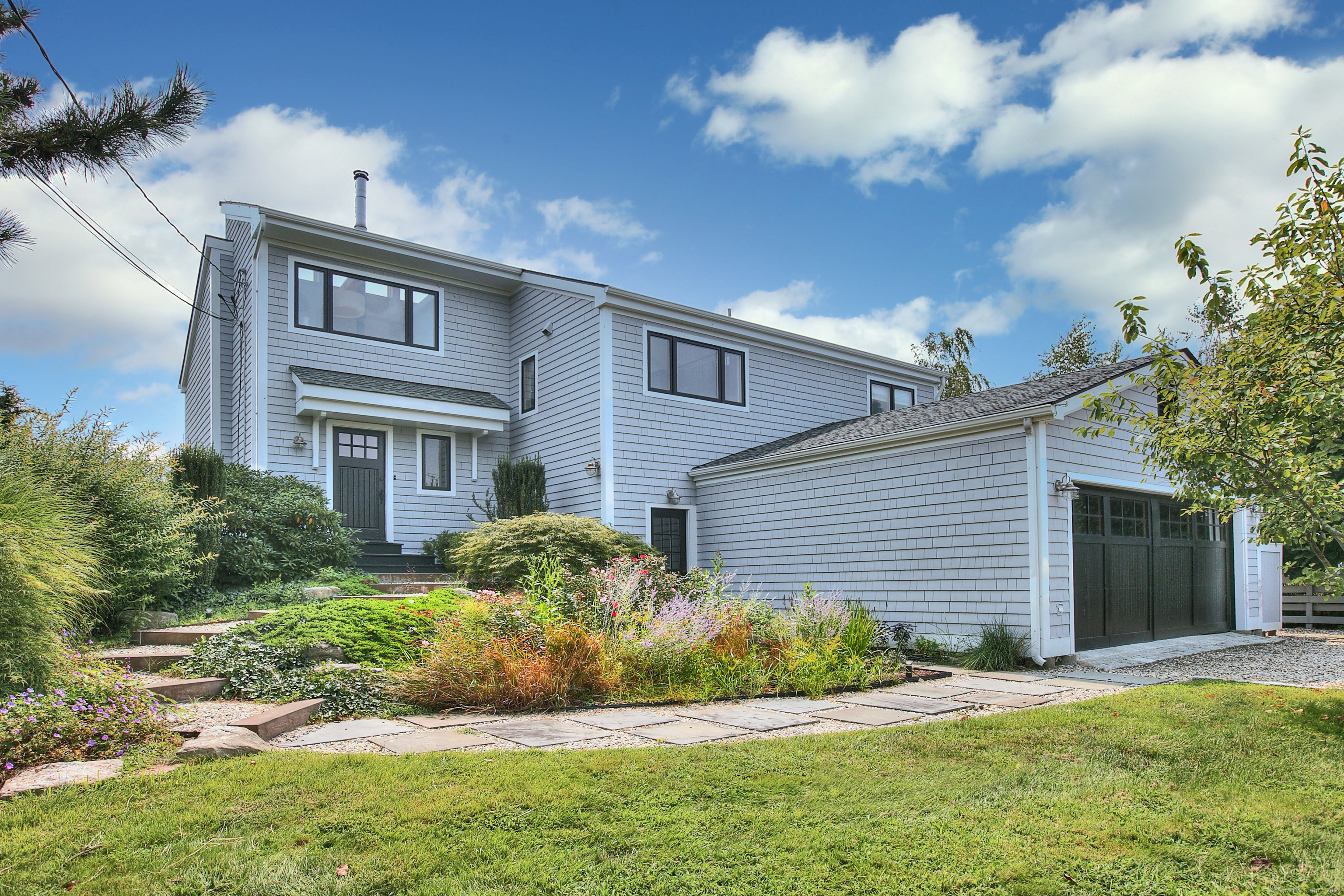 a front view of a house with a yard