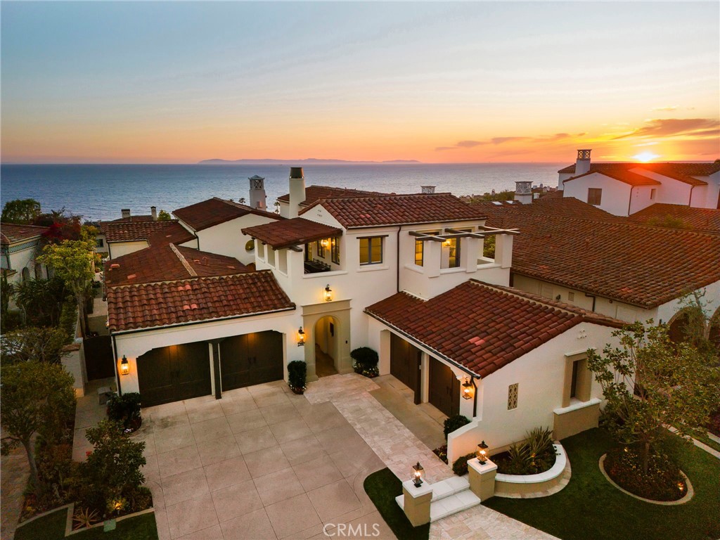 an aerial view of a house with a garden and balcony