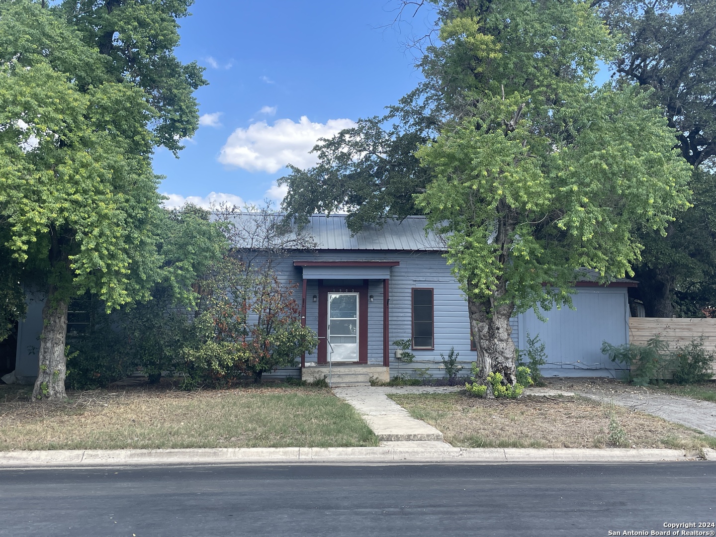 a front view of a house with garage