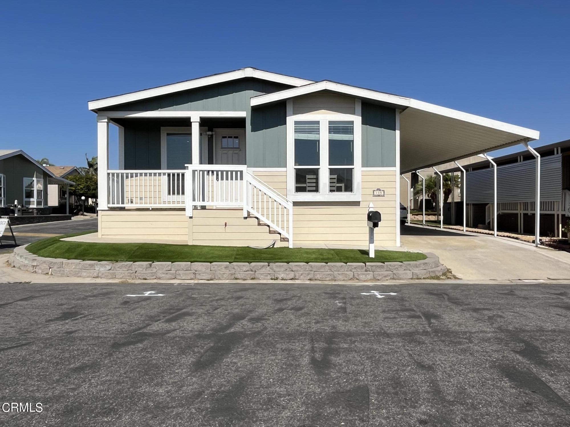 a house with yard in front of it