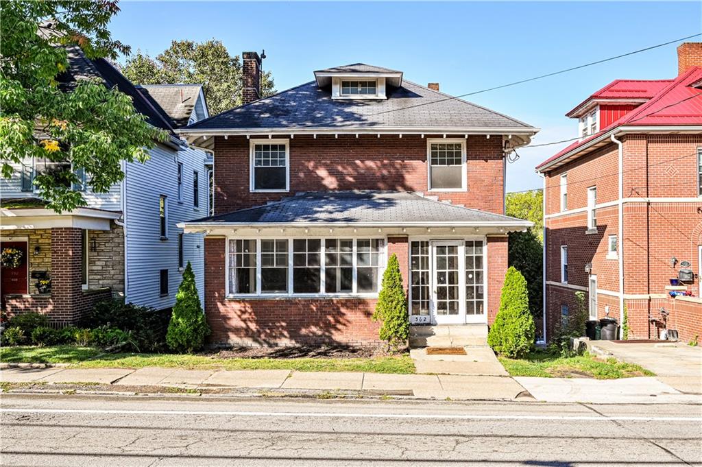 a front view of a house with a porch