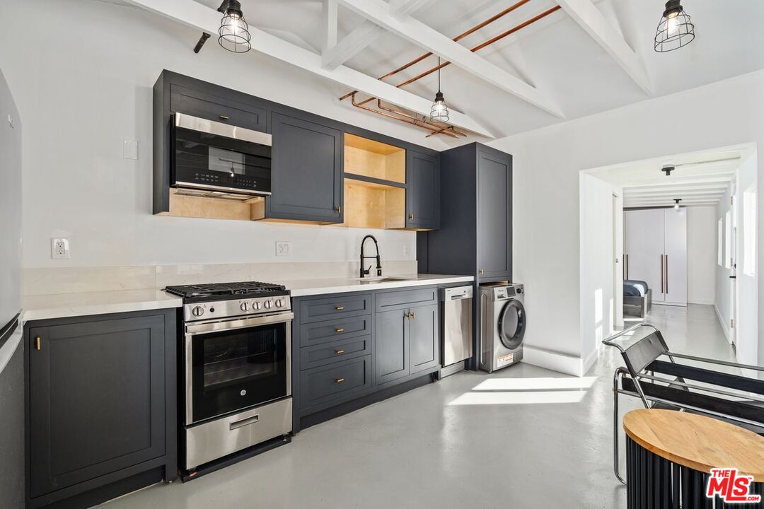 a kitchen with a stove and a sink