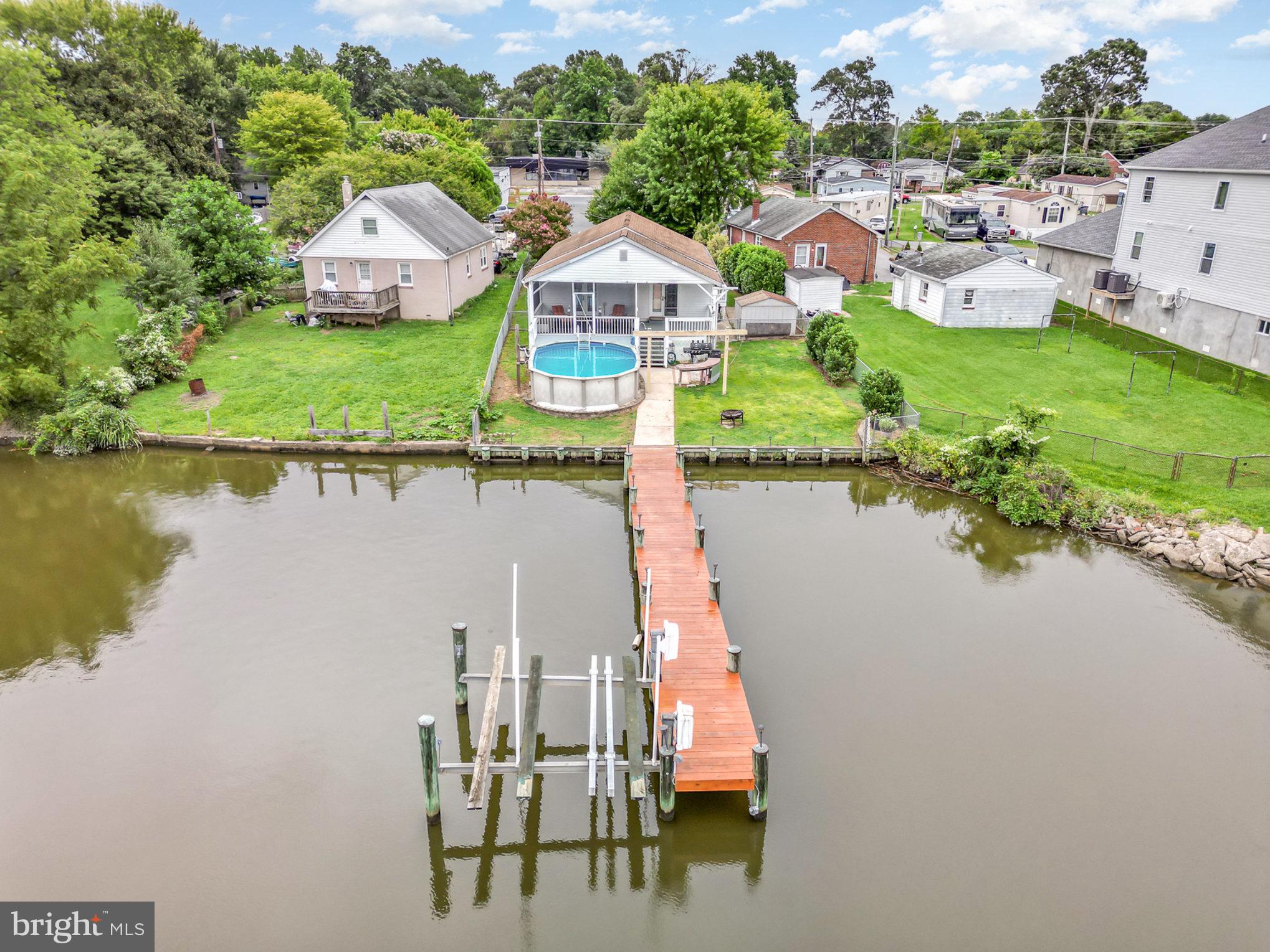 a view of houses with outdoor space and lake view