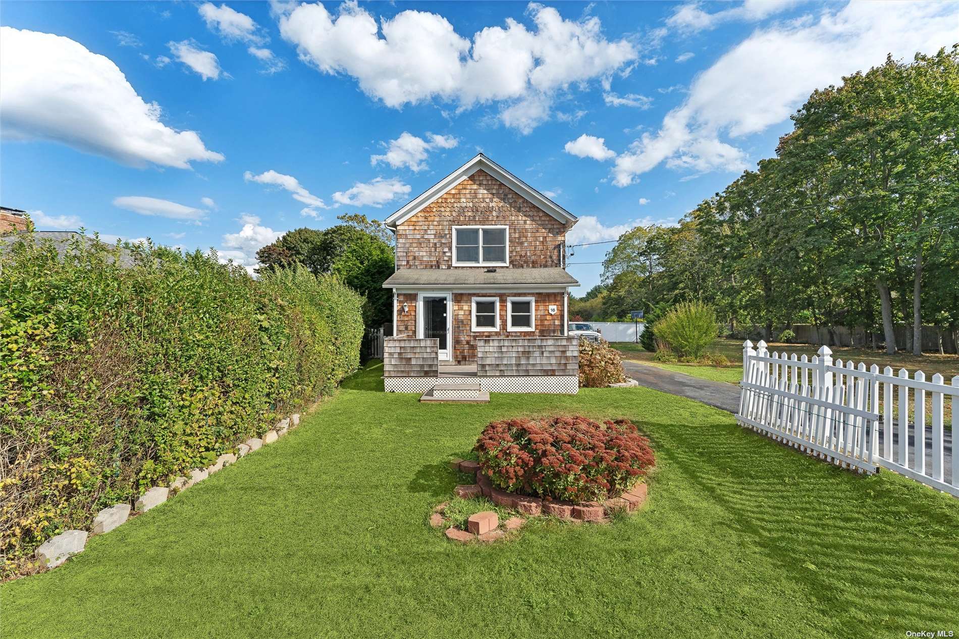 a house view with a garden space