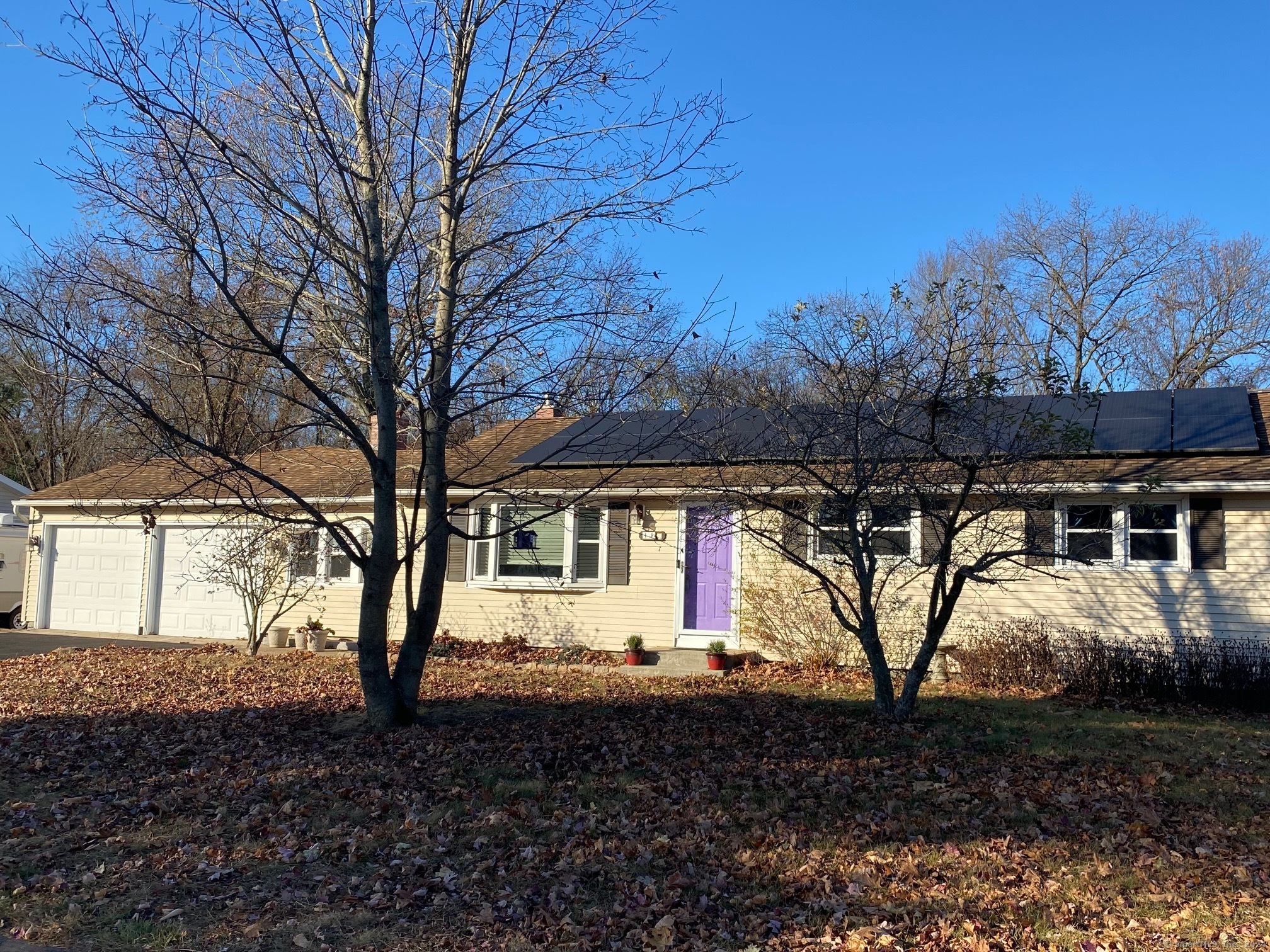 a view of house with a yard