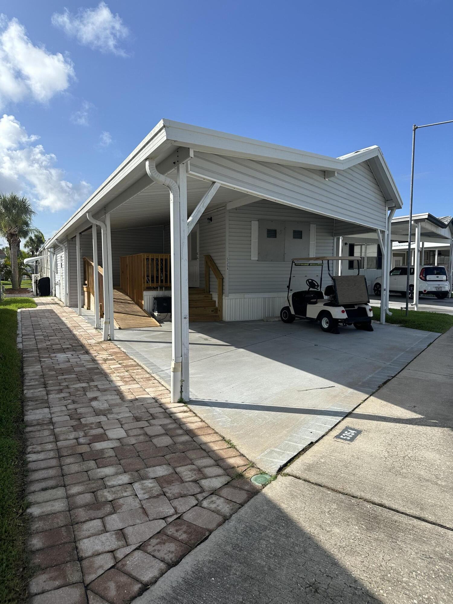 a view of a car park in front of house