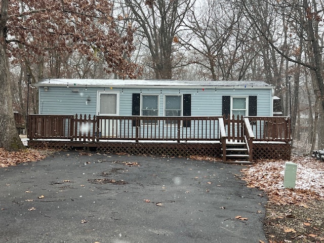 a view of a house with a yard in the back