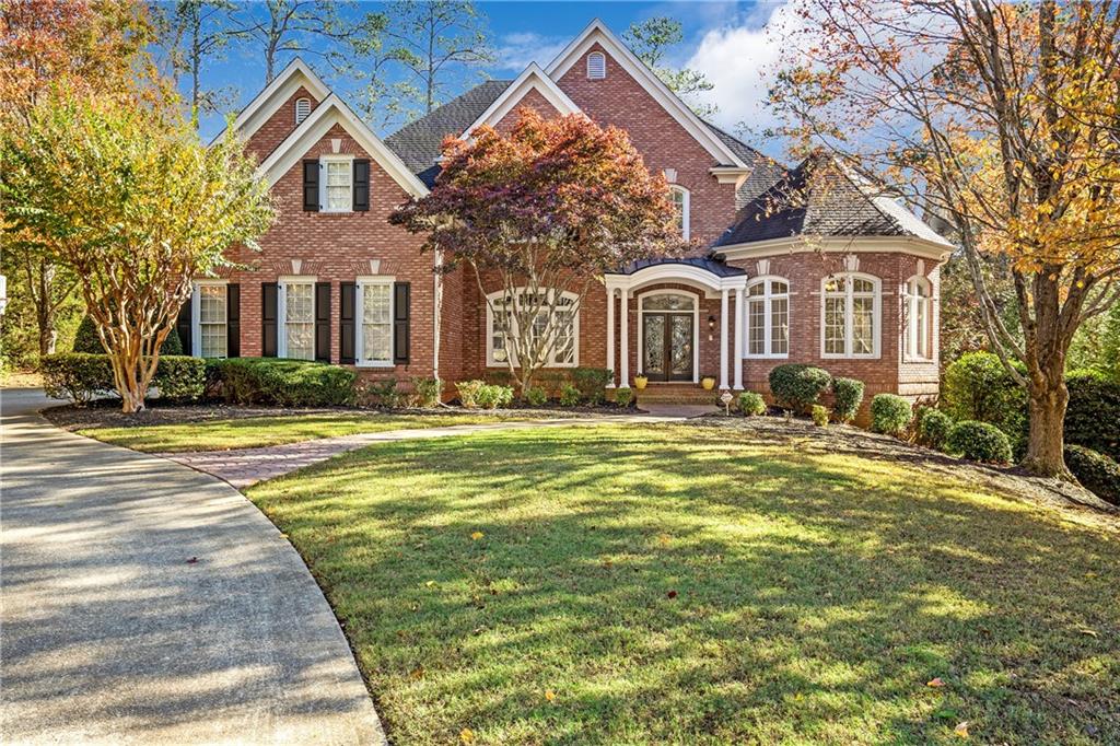 a front view of a house with a yard