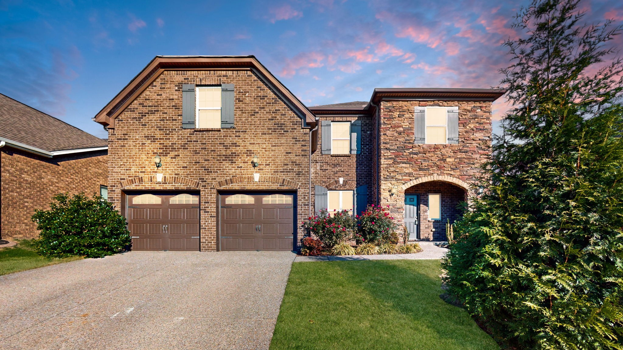 a front view of a house with a yard