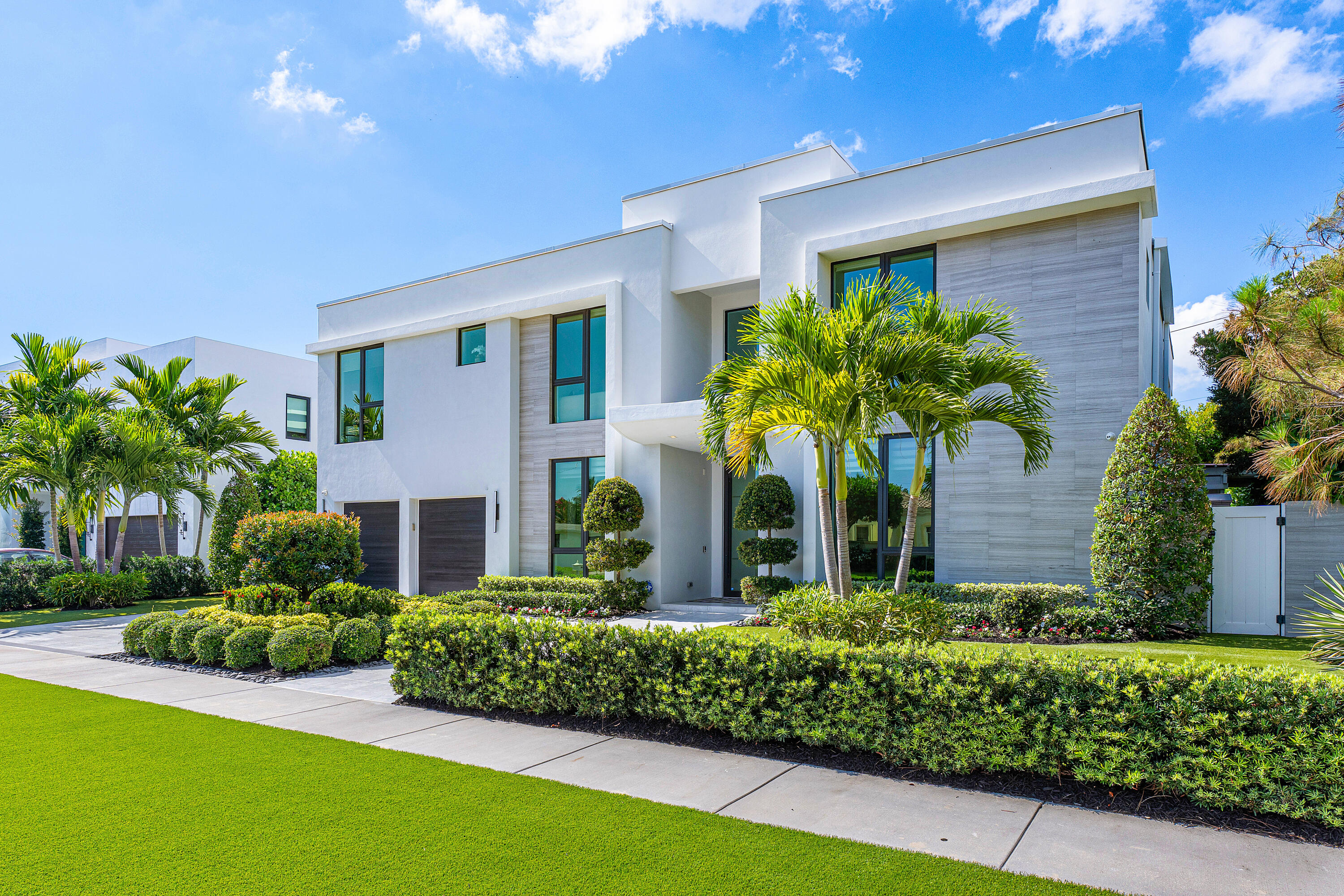 a front view of a house with a yard