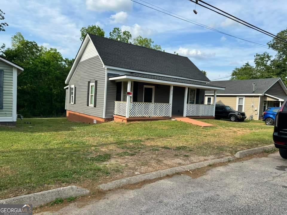 a front view of a house with a yard