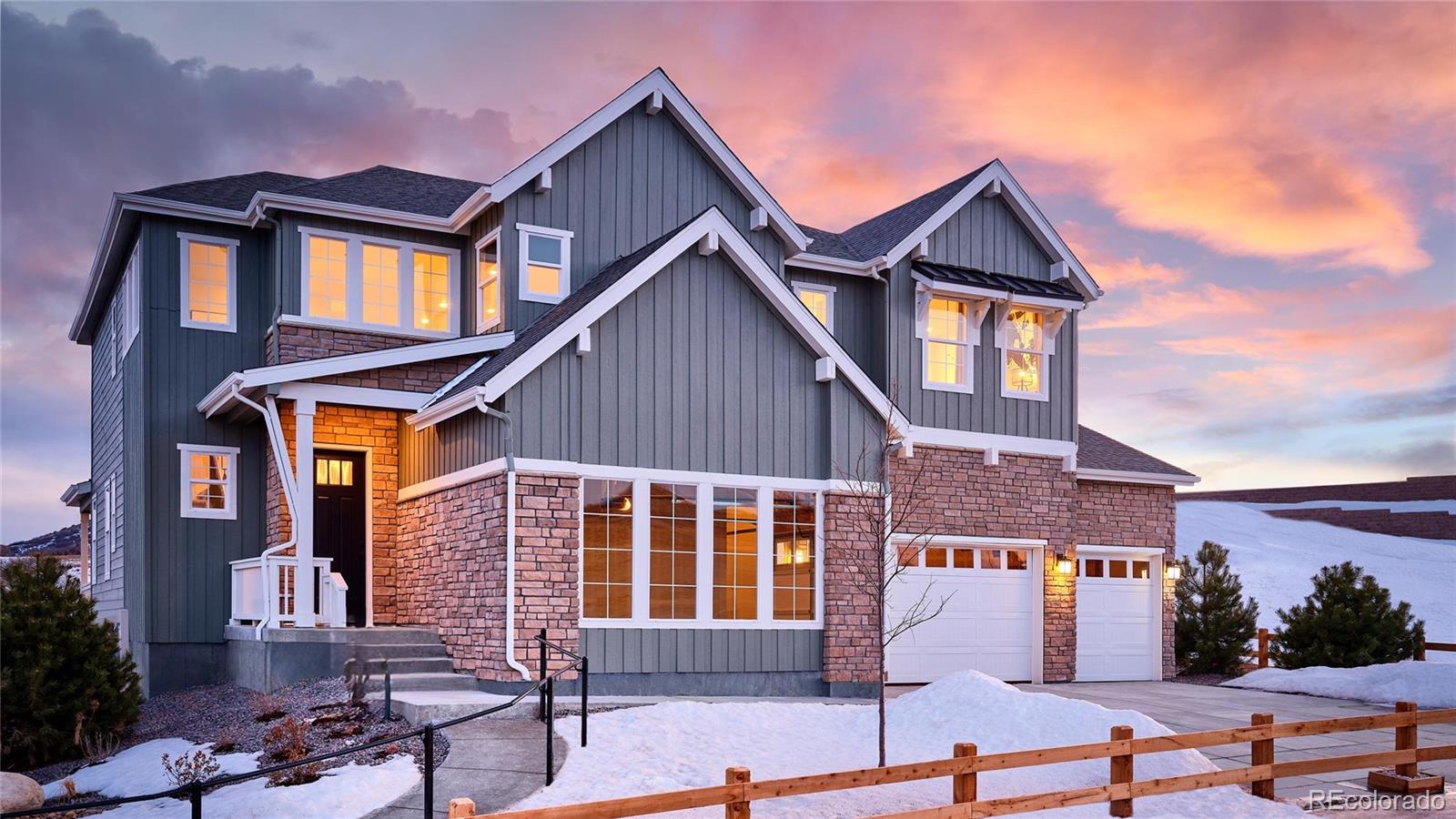 a front view of a house with a garage