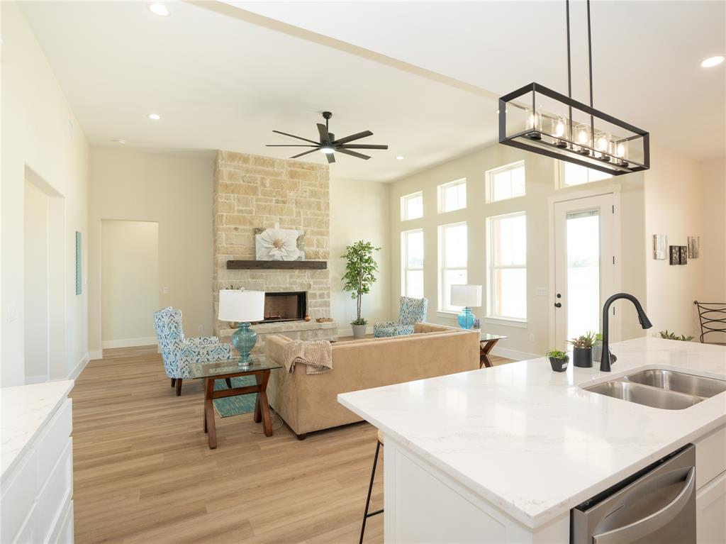 a view of a a dining room with furniture window and wooden floor