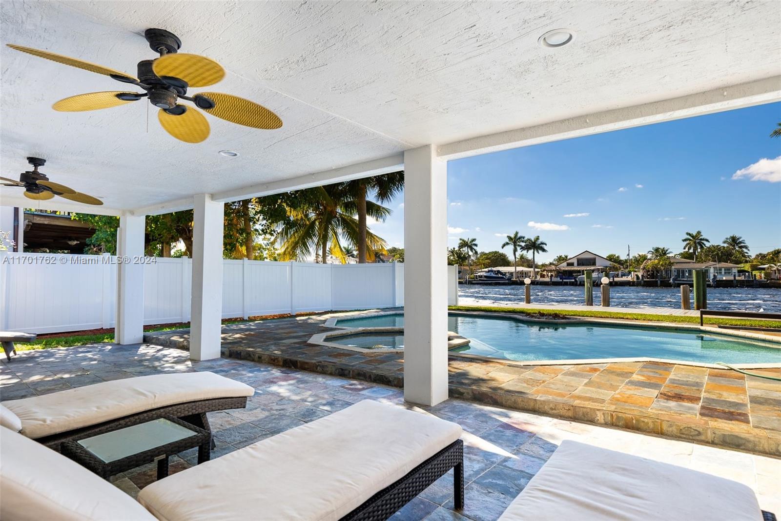 a view of swimming pool with chairs