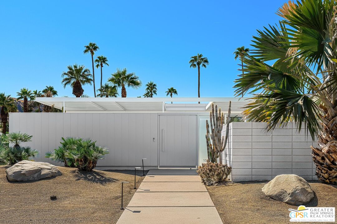 a view of a house with a potted plant