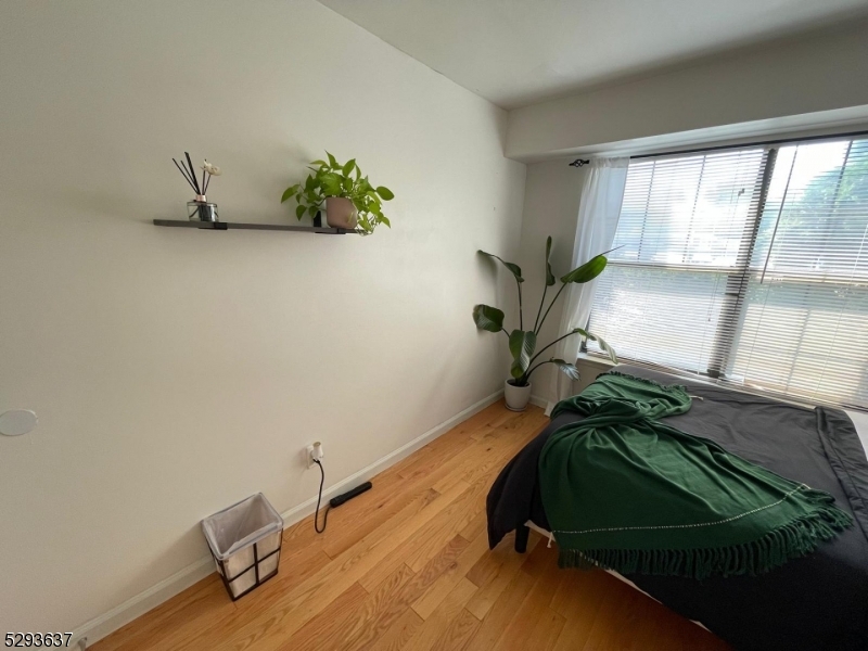 a view of a room with gym equipment and a window