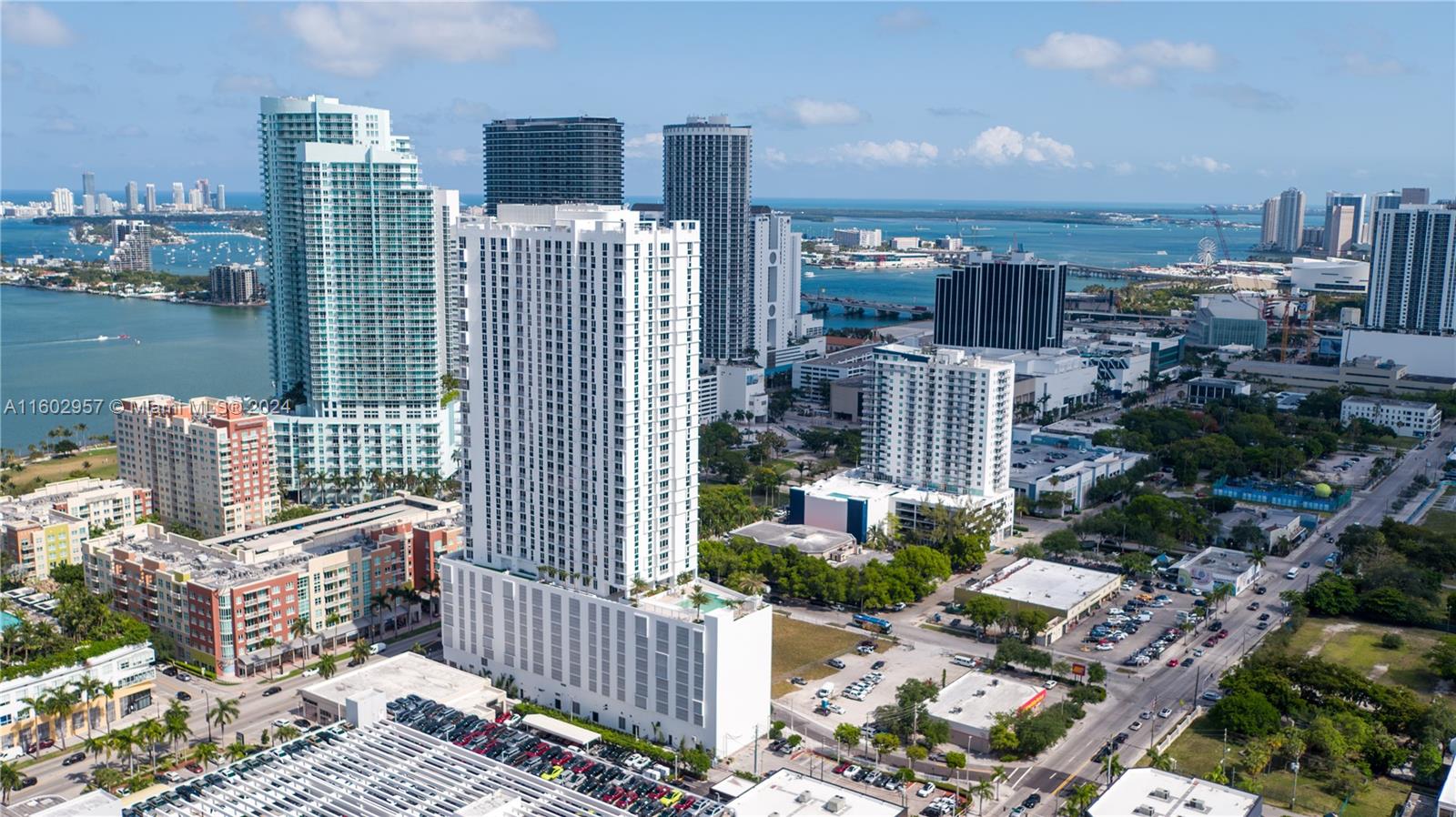 a city view with tall buildings and ocean view