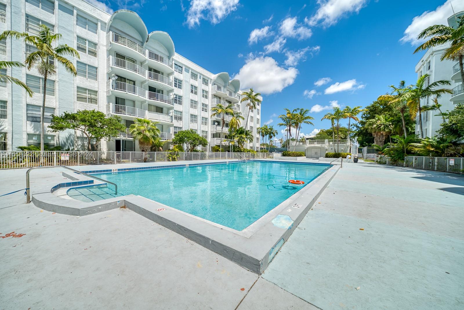 a view of a swimming pool with a patio