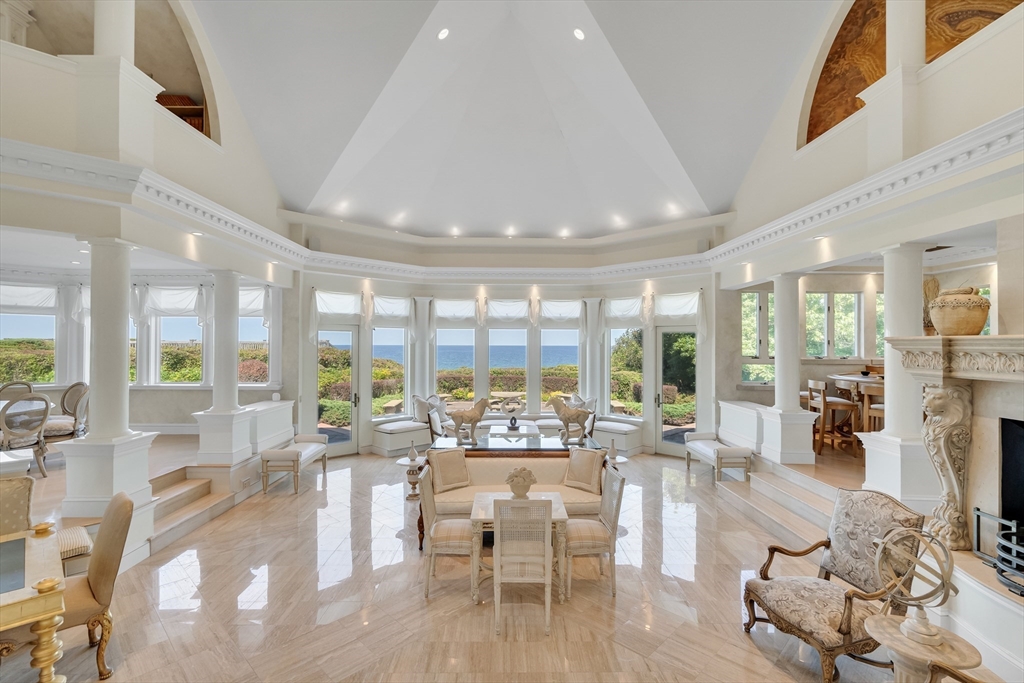 a very nice looking living room with furniture and a large window