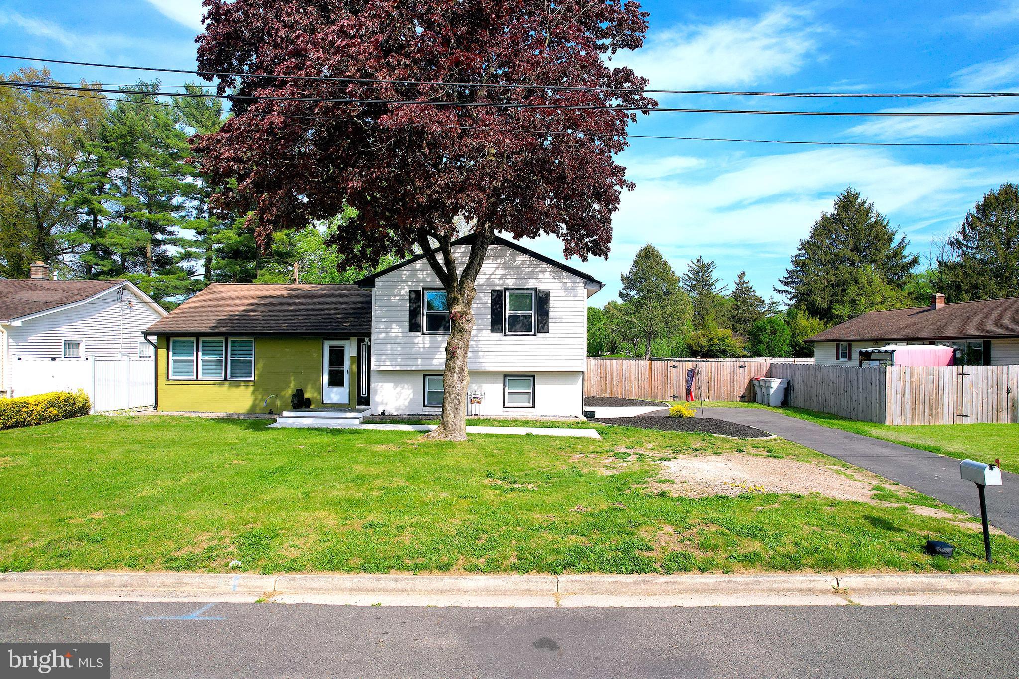 a house view with a sitting space and garden