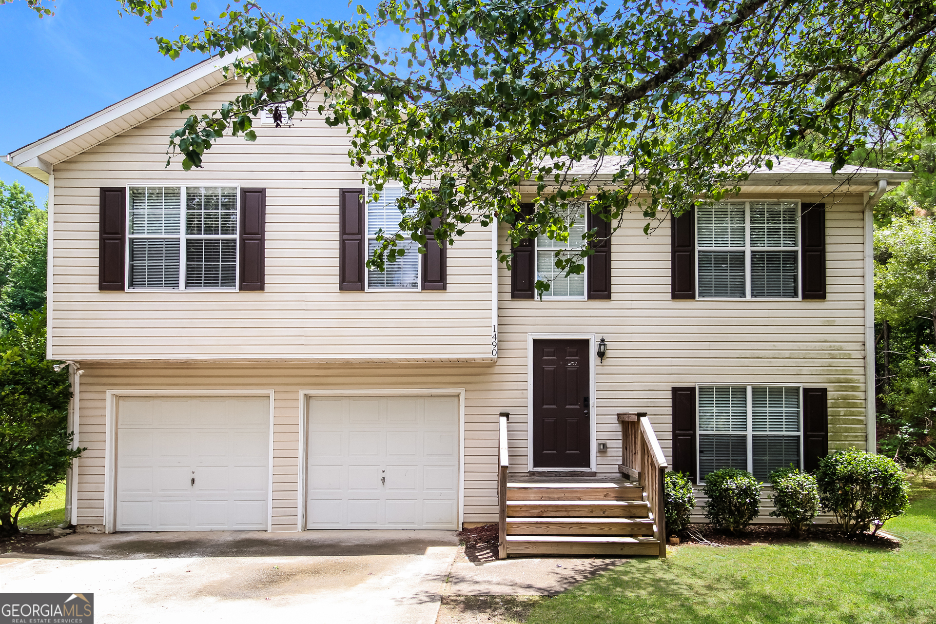 a front view of a house with a garage